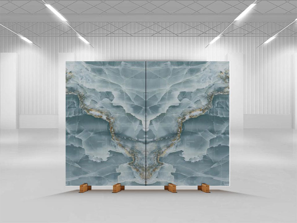 Onyx Oceano slab display featuring blue-gray tones with golden veining in symmetrical pattern — premium countertop fabrication by Signature Stone Las Vegas