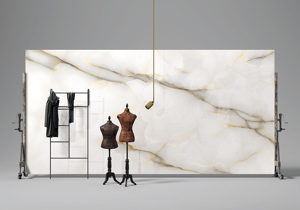 Onyx Perla slab with white base and golden veining displayed in showroom — premium countertop fabrication by Signature Stone Las Vegas