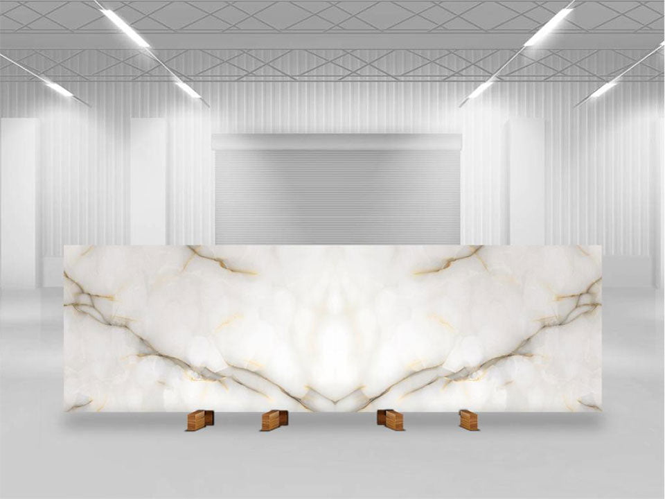 Onyx Perla slab with white base and golden veining displayed in showroom — custom countertops fabricated and installed by Signature Stone LV