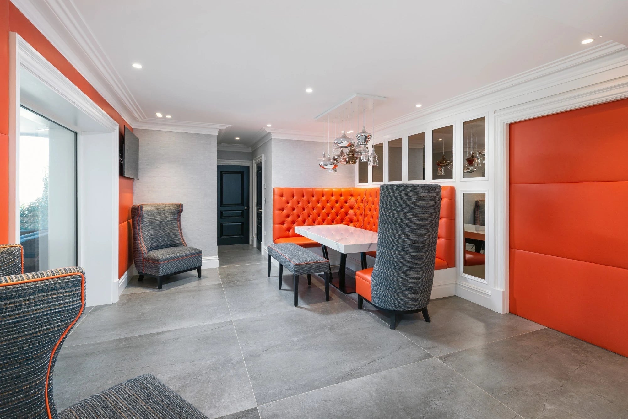 Dekton Olimpo dining table with white surface and dark base — dekton countertops installed by Signature Stone Las Vegas
