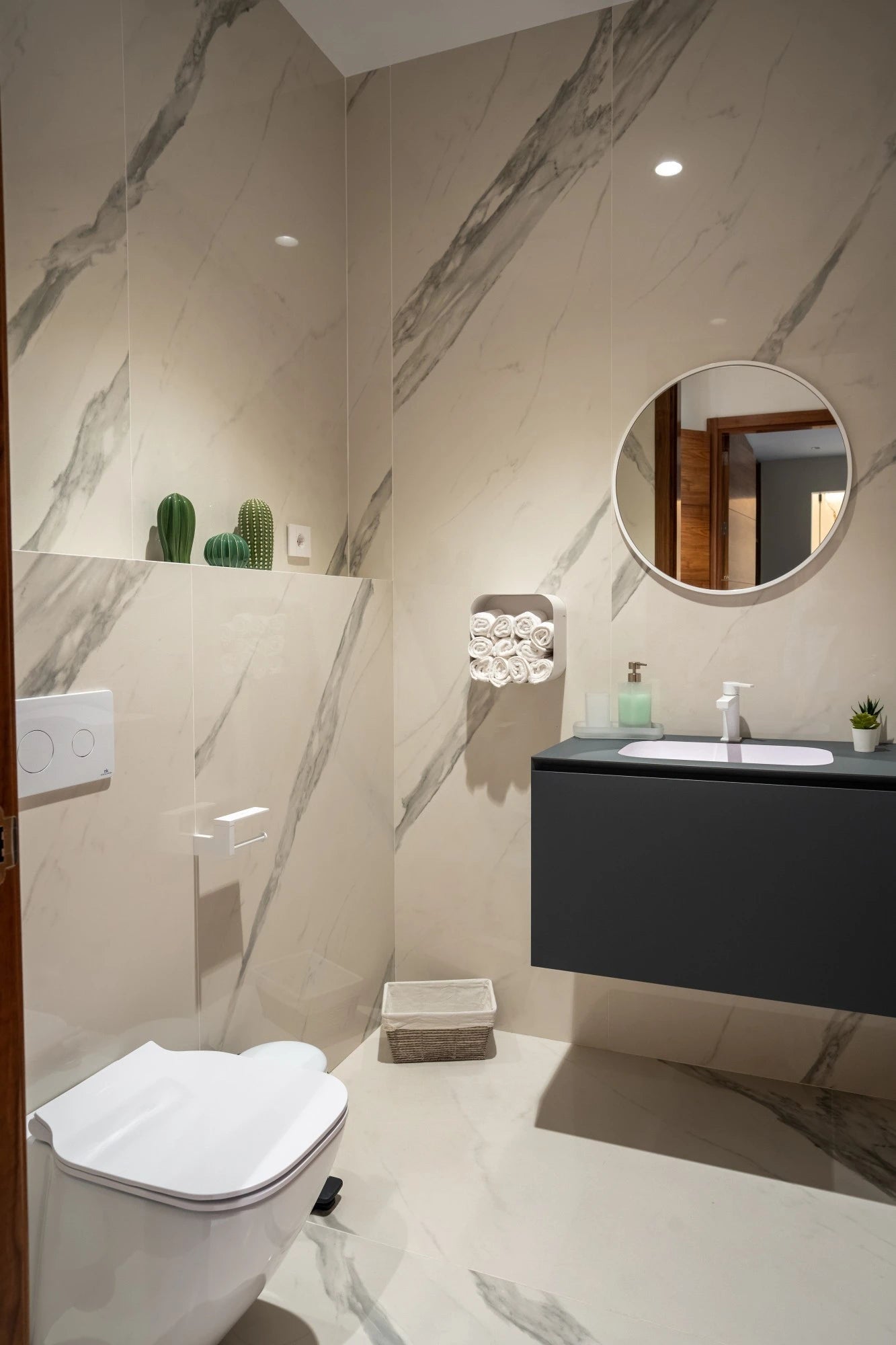 Dekton Olimpo bathroom vanity featuring white marble-look veining and matte finish — premium dekton surfaces fabricated and installed by Signature Stone LV