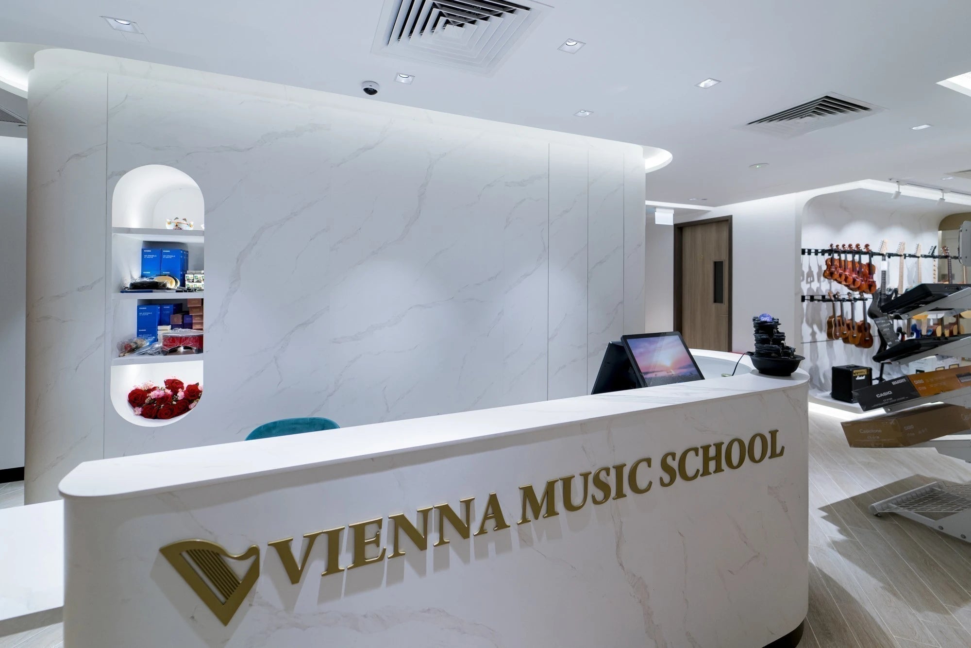 Dekton Opera reception counter with white marble-look finish and curved edges — premium dekton kitchen countertops by Signature Stone Las Vegas