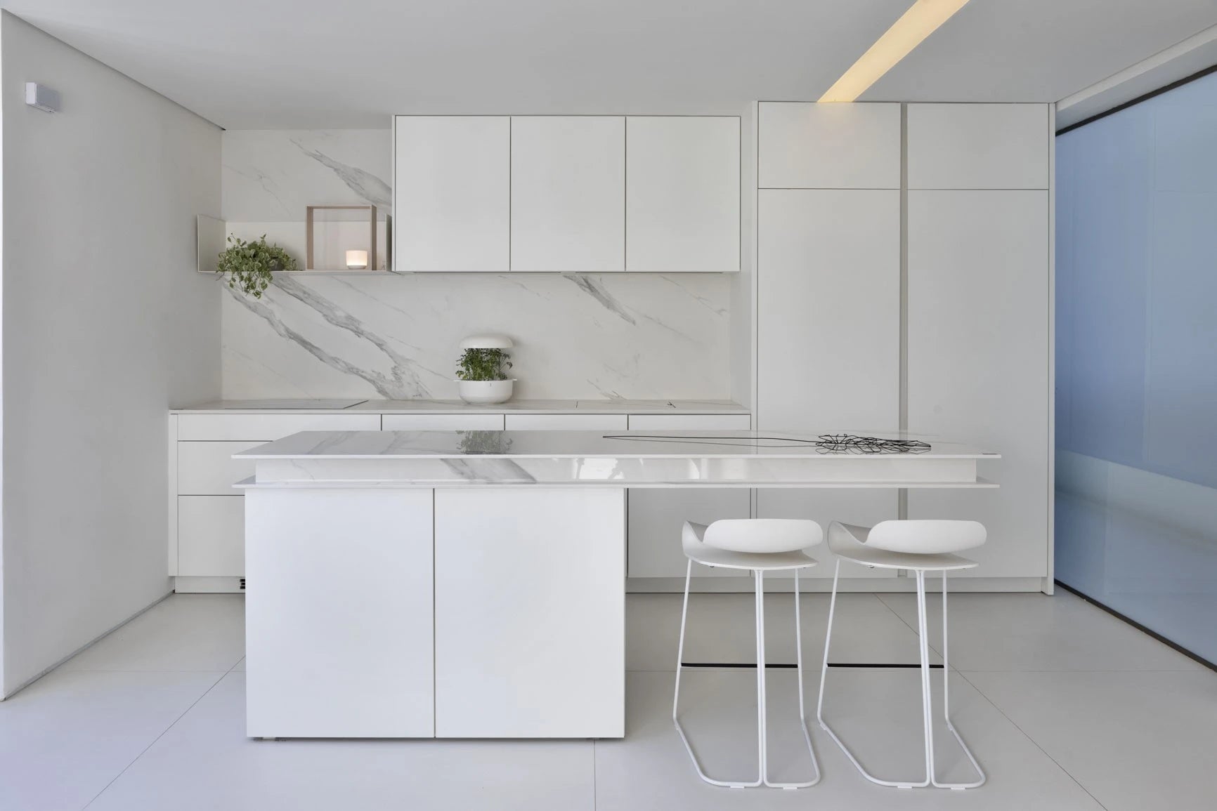 Dekton Opera kitchen island and backsplash with white marble veining and clean lines — modern dekton countertops installed by Signature Stone Las Vegas