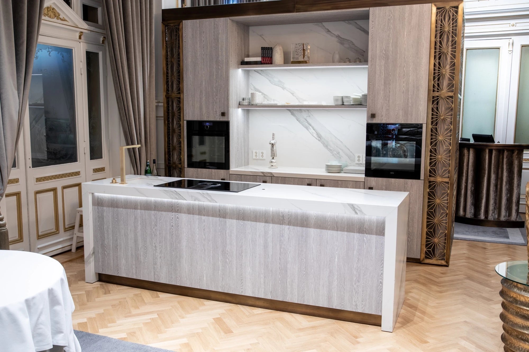 Dekton Opera kitchen island with white marble-look veining and waterfall edge — premium dekton kitchen countertops by Signature Stone Las Vegas