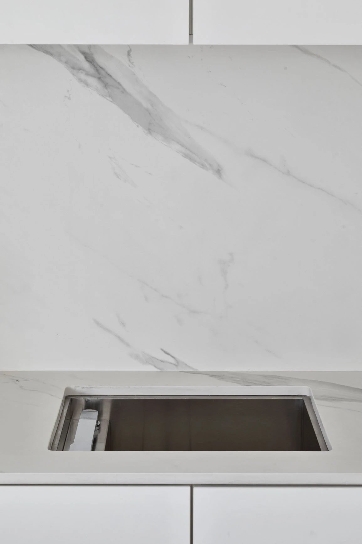 Dekton Opera kitchen countertop with white marble veining and undermount sink — premium dekton surfaces fabricated and installed by Signature Stone LV