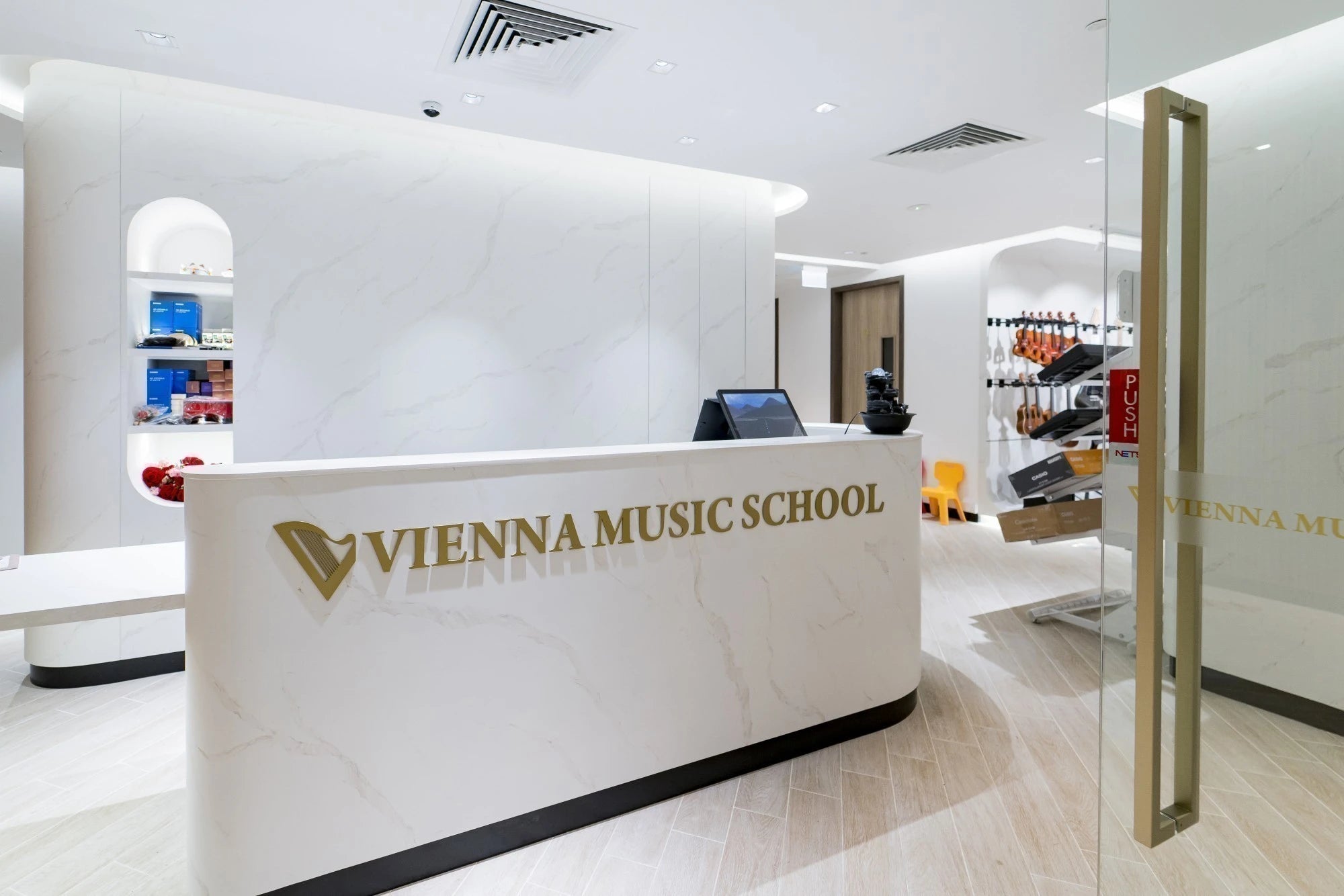 Dekton Opera reception desk with white finish and curved design — premium dekton surfaces fabricated and installed by Signature Stone LV