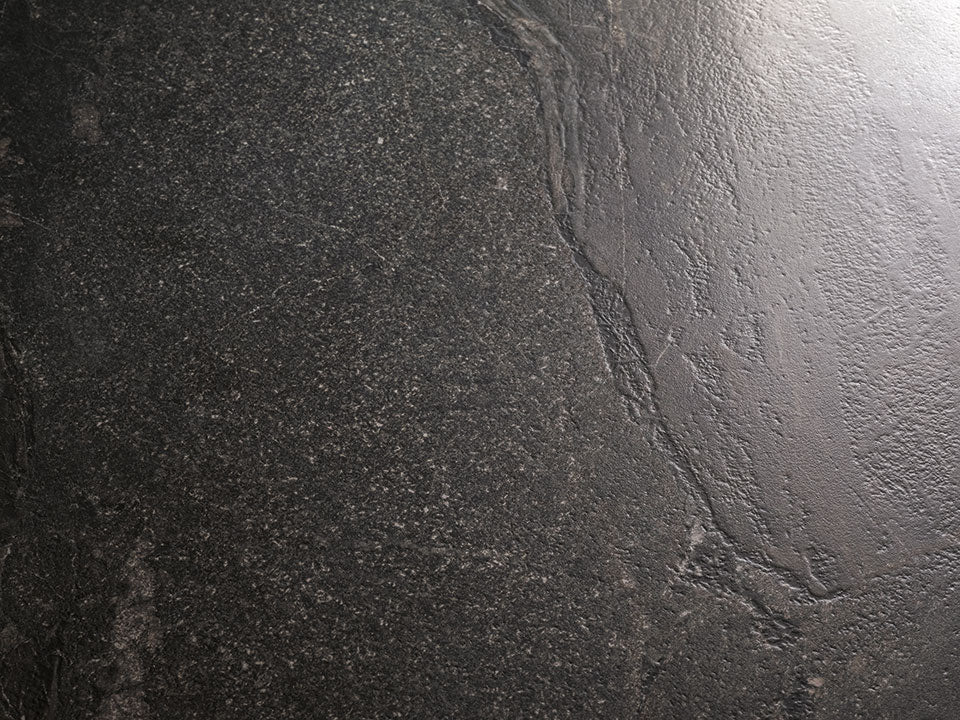 Pietra Rustica stone surface with dark textured finish and natural veining patterns — expert countertop fabrication by Signature Stone Las Vegas