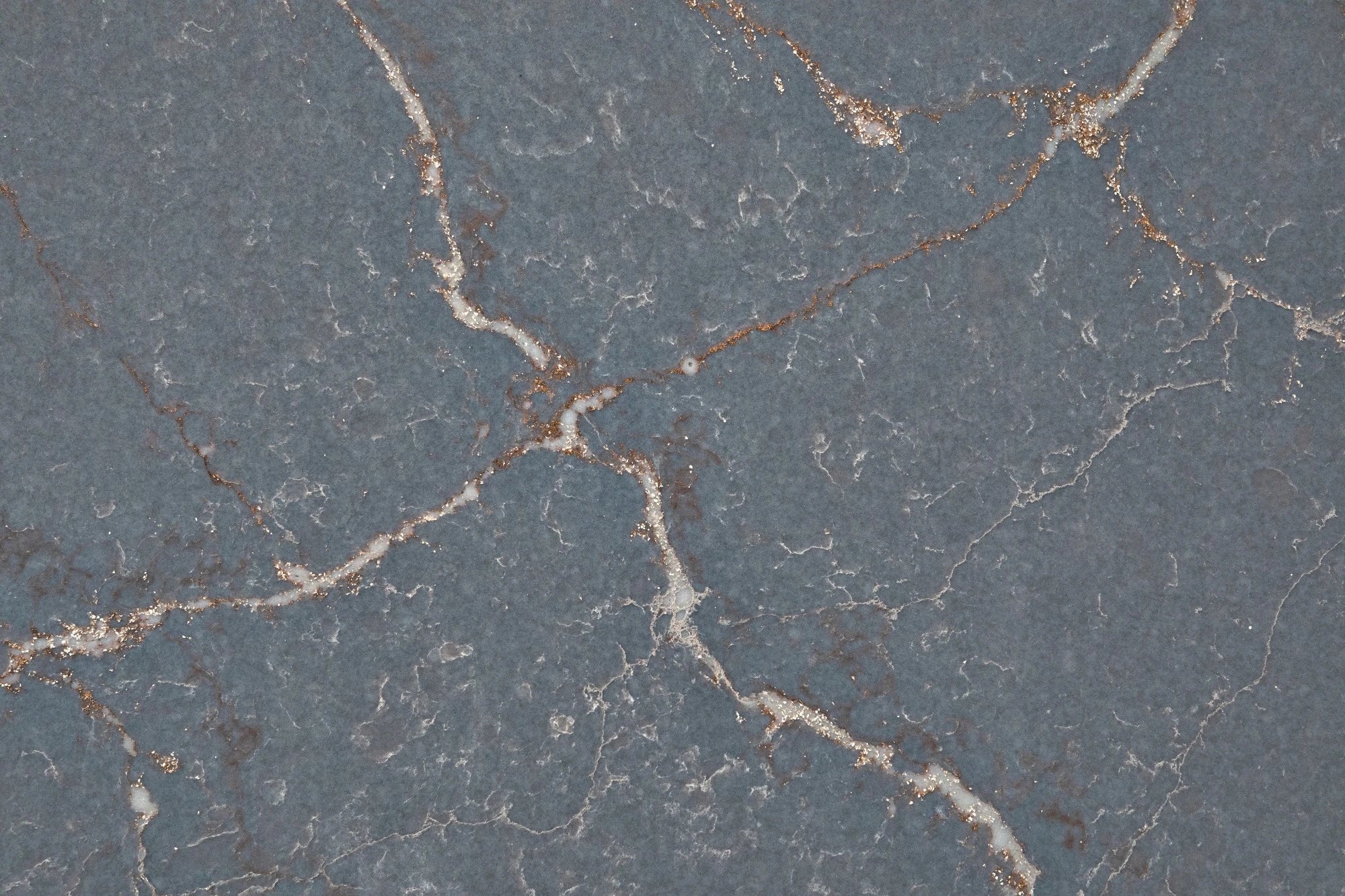 Silestone Parisien Bleu surface with deep blue-gray background and gold veining pattern — quartz countertops installed by Signature Stone Las Vegas