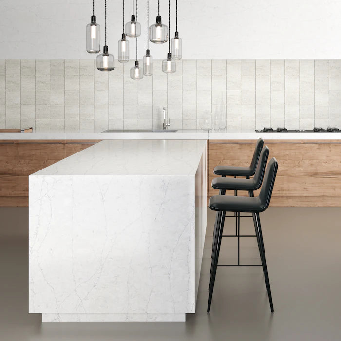 Silestone Pearl Jasmine kitchen island with white marble-look veining and waterfall edge — engineered quartz countertops fabricated and installed by Signatur...
