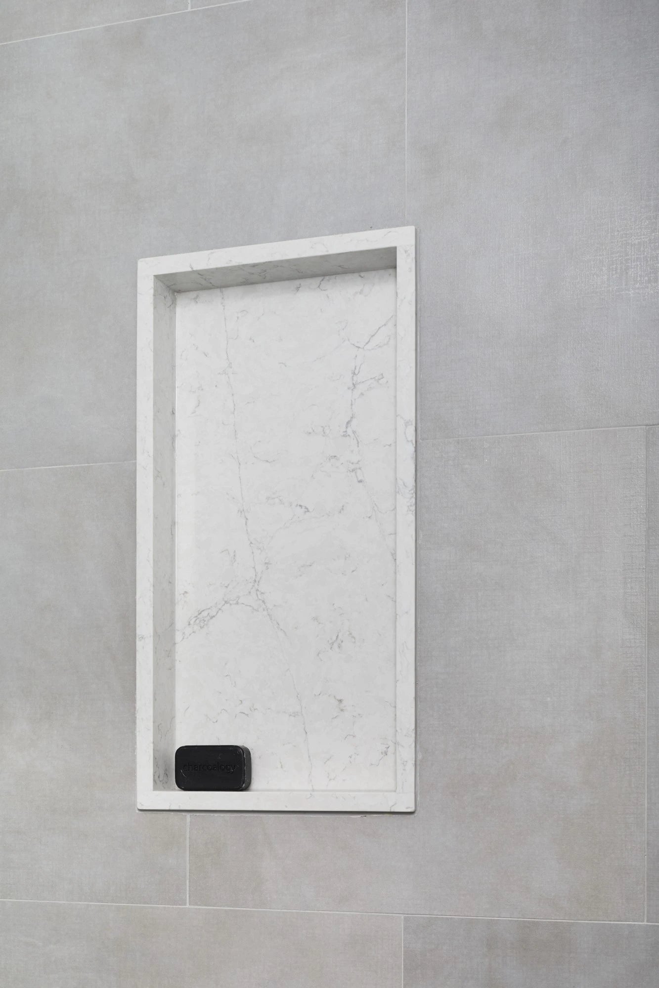Silestone Pearl Jasmine quartz shower niche with white marble veining and clean rectangular frame — quartz countertops near me by Signature Stone Las Vegas