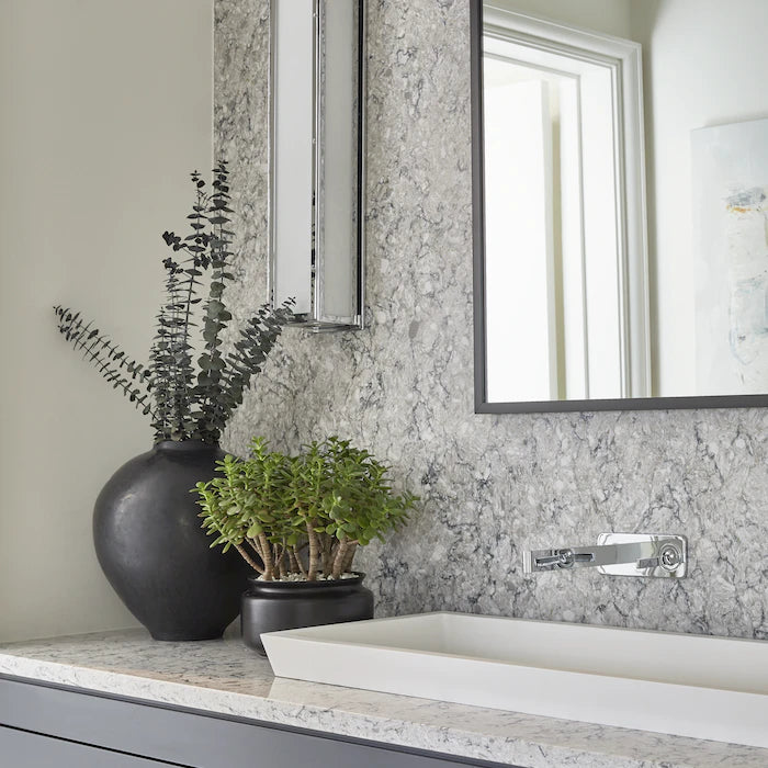 Silestone Pietra bathroom vanity with white marble-look veining and polished finish — engineered quartz countertops fabricated and installed by Signature Sto...