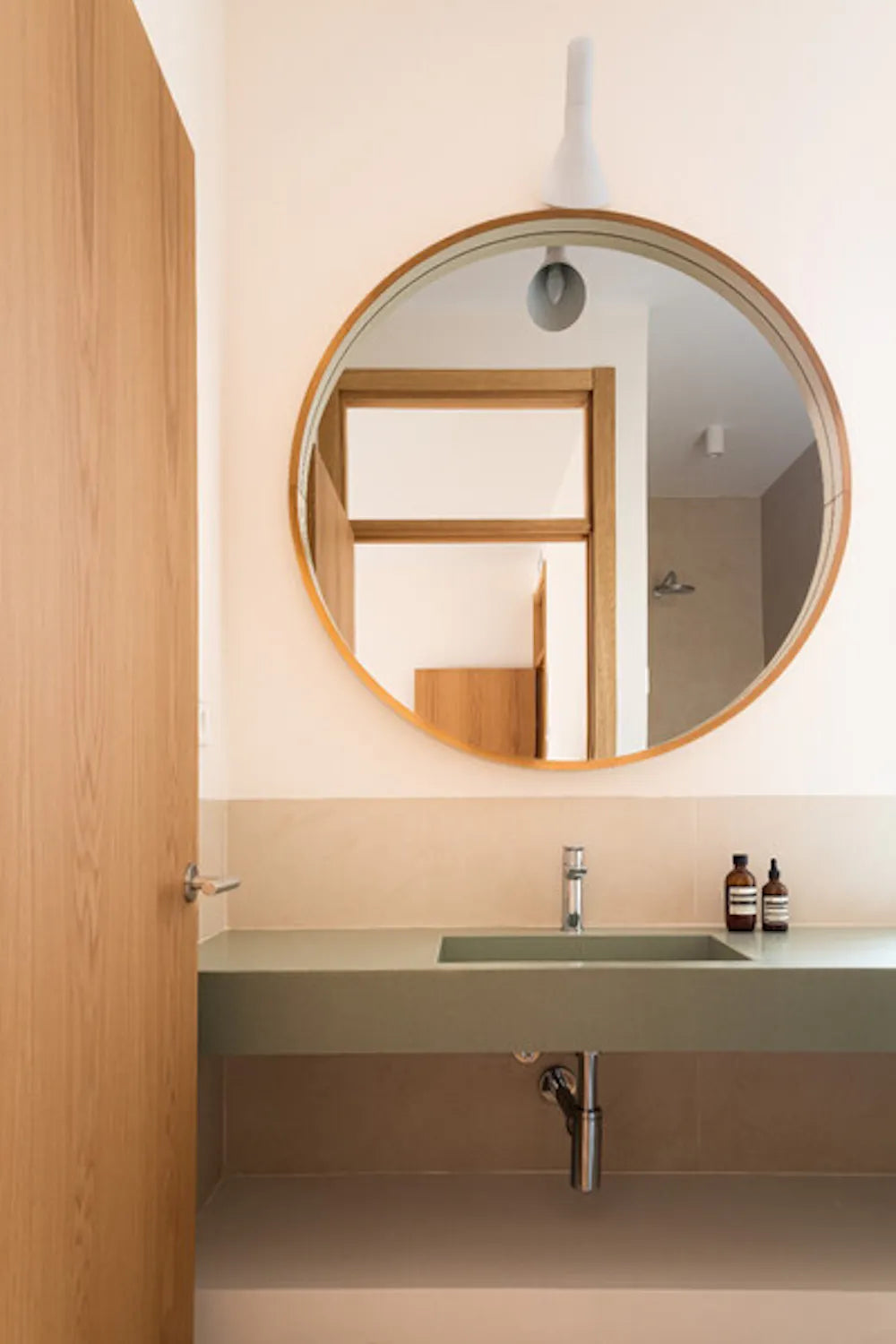 Silestone Posidonia Green bathroom vanity with sage green finish and integrated sink — engineered quartz countertops fabricated and installed by Signature St...