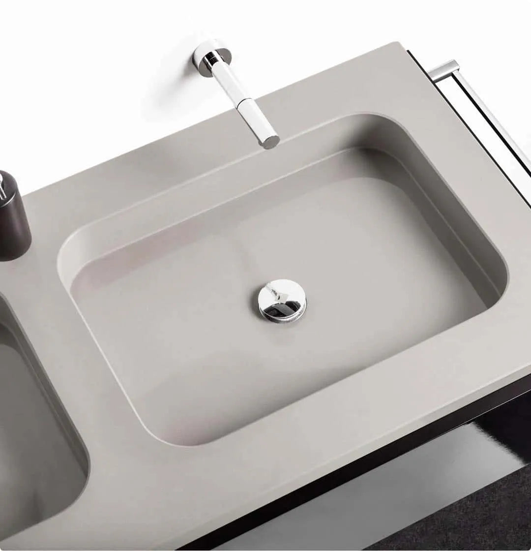 Silestone quartz washbasin with integrated rectangular sink and wall-mounted faucet — modern quartz countertops installed by Signature Stone Las Vegas