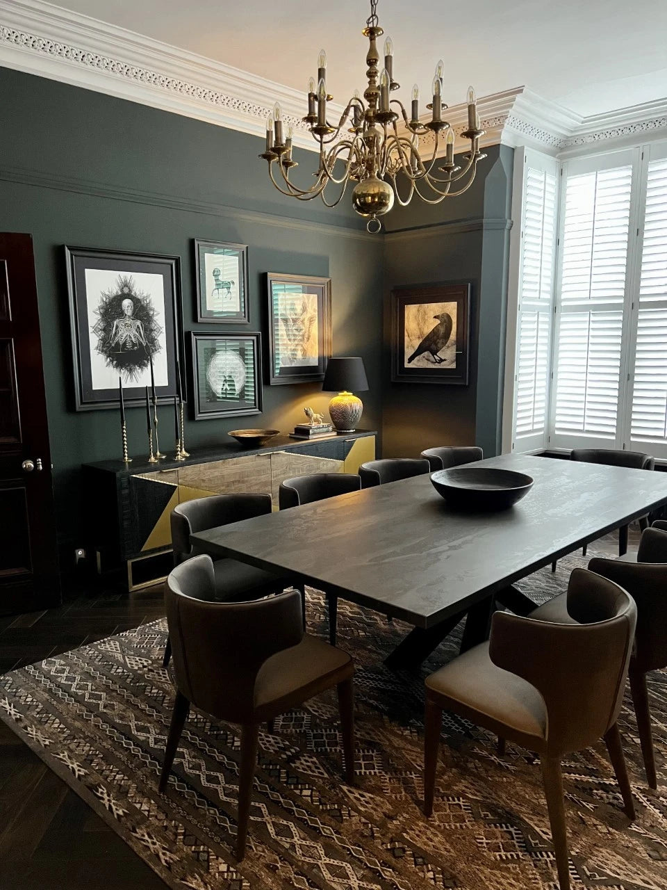Dekton Radium dining table with dark charcoal finish and clean edges in elegant room — dekton countertops installed by Signature Stone Las Vegas