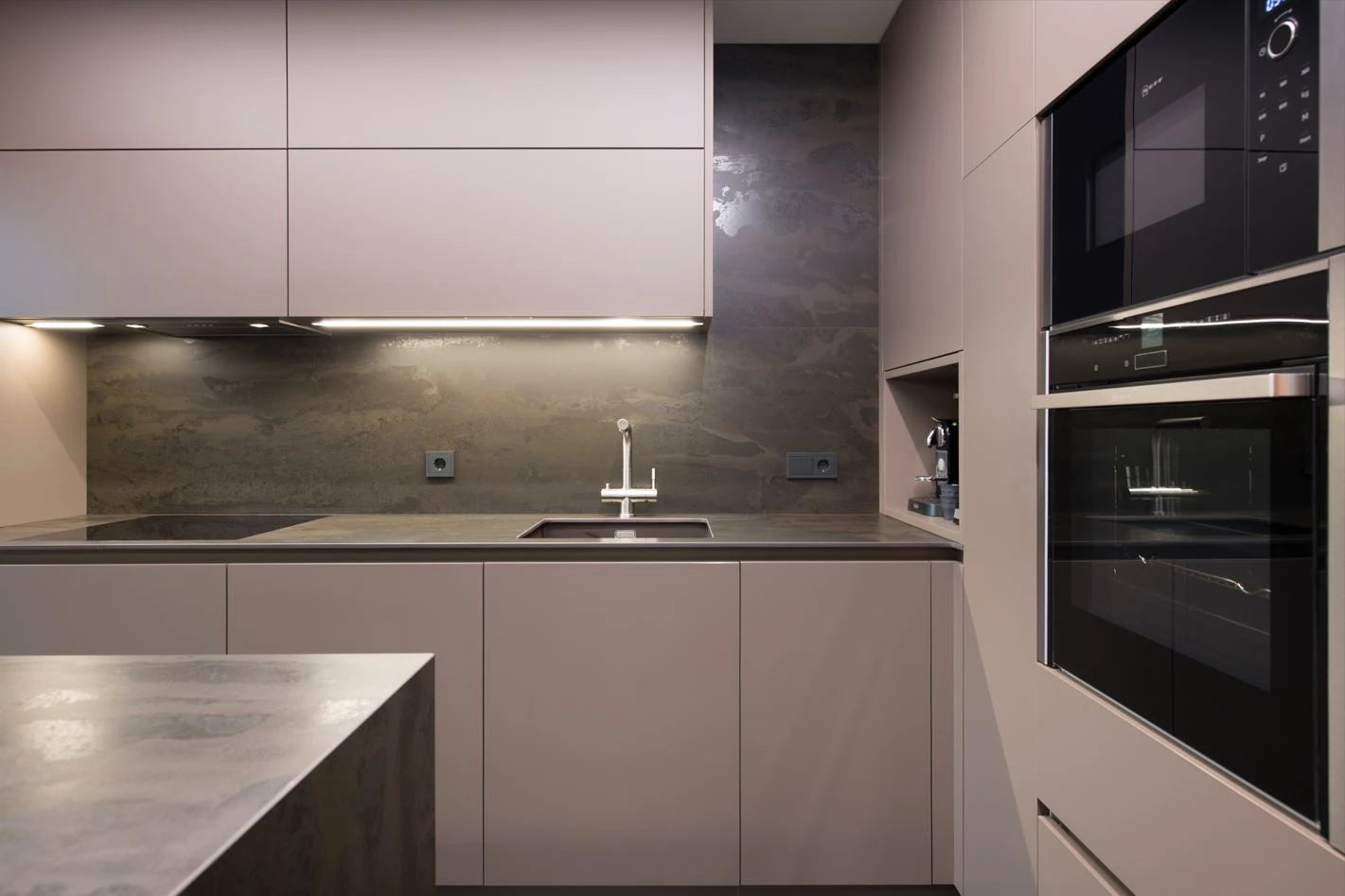 Dekton Radium kitchen countertops with matte gray finish and integrated sink — premium dekton surfaces fabricated and installed by Signature Stone LV