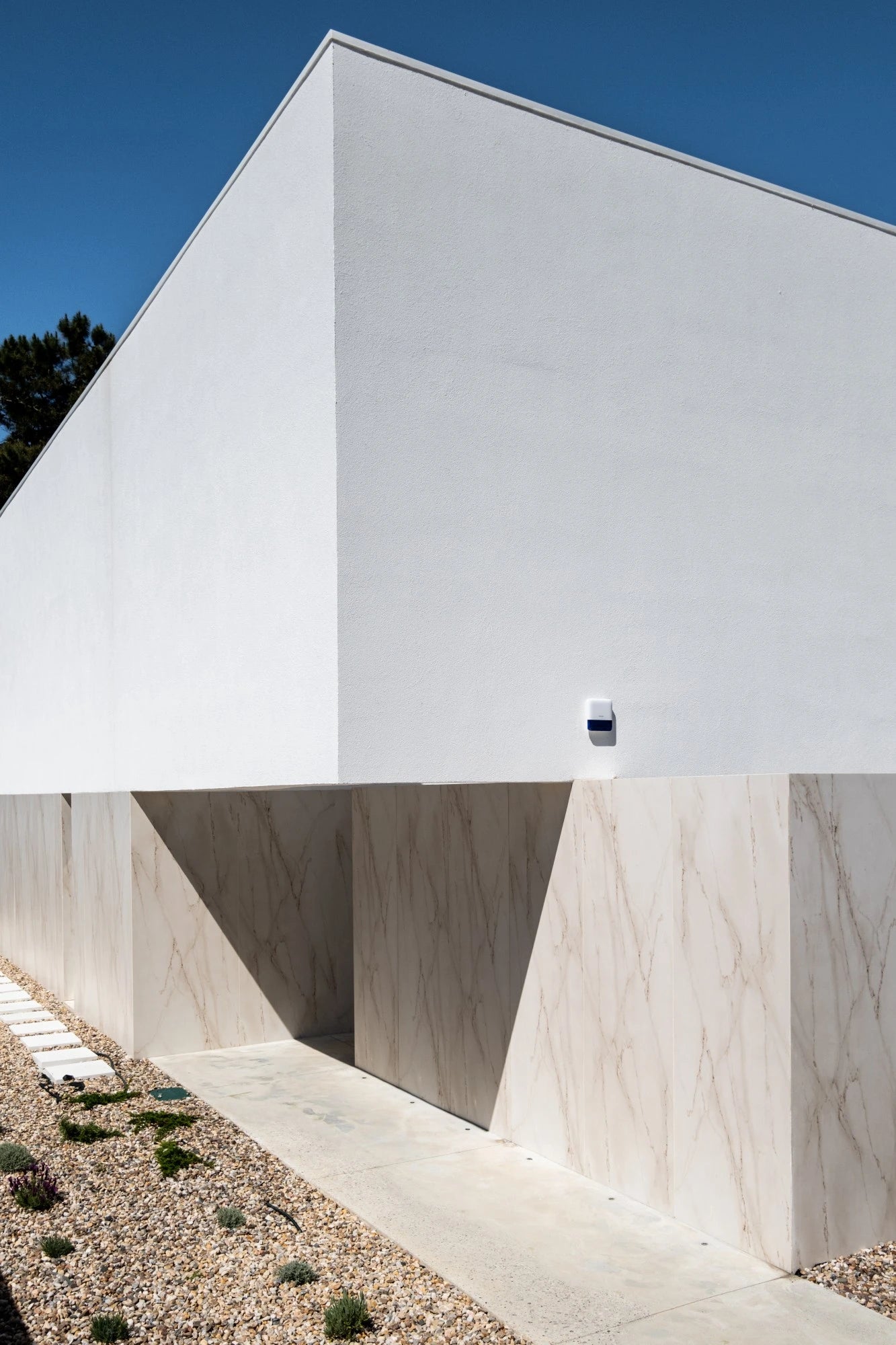 Dekton Rem surfaces with white marble-like veining on modern architectural walls — premium dekton kitchen countertops by Signature Stone Las Vegas