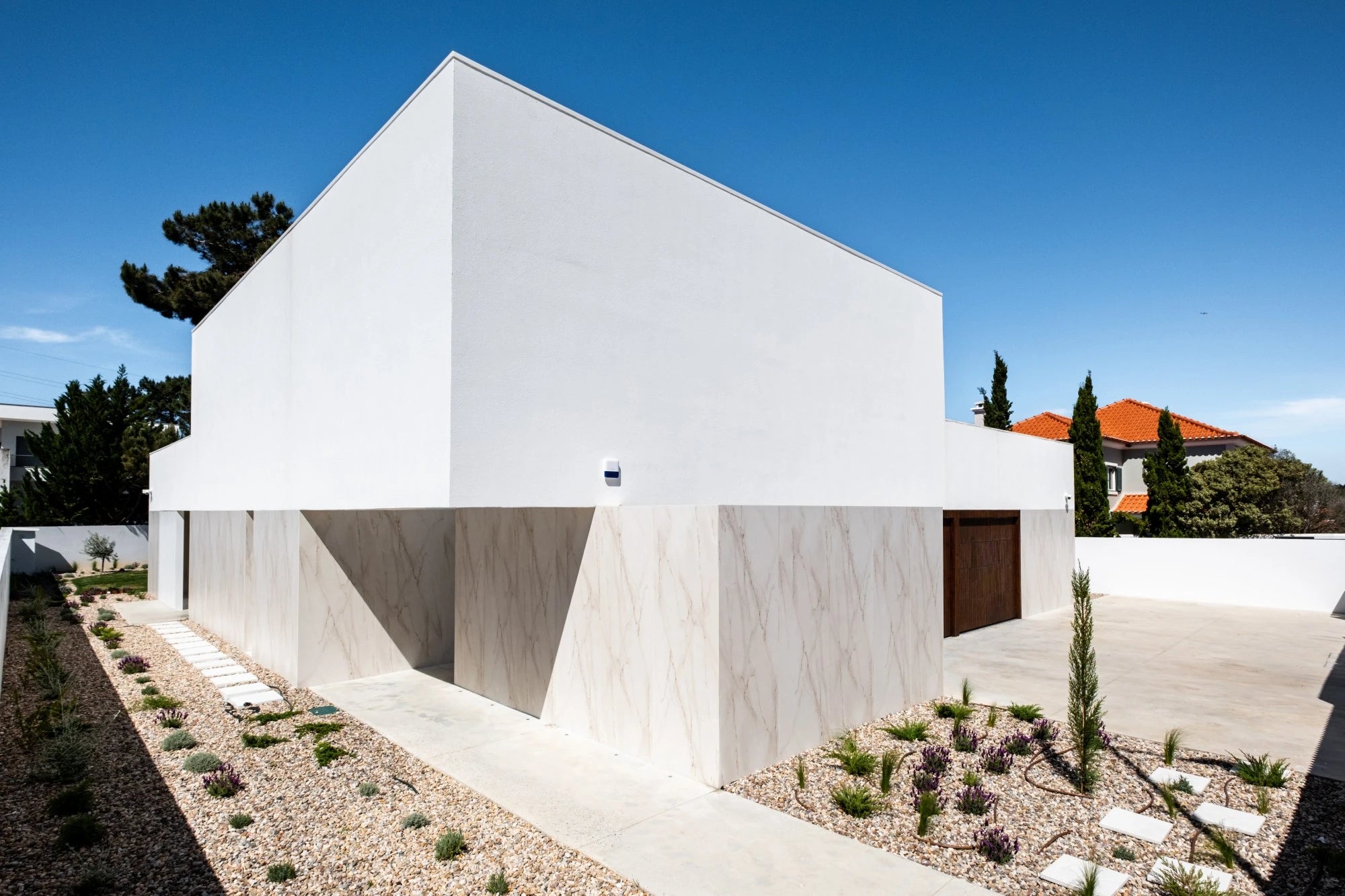 Dekton Rem exterior cladding with white marble-look veining and matte finish — dekton countertops installed by Signature Stone Las Vegas