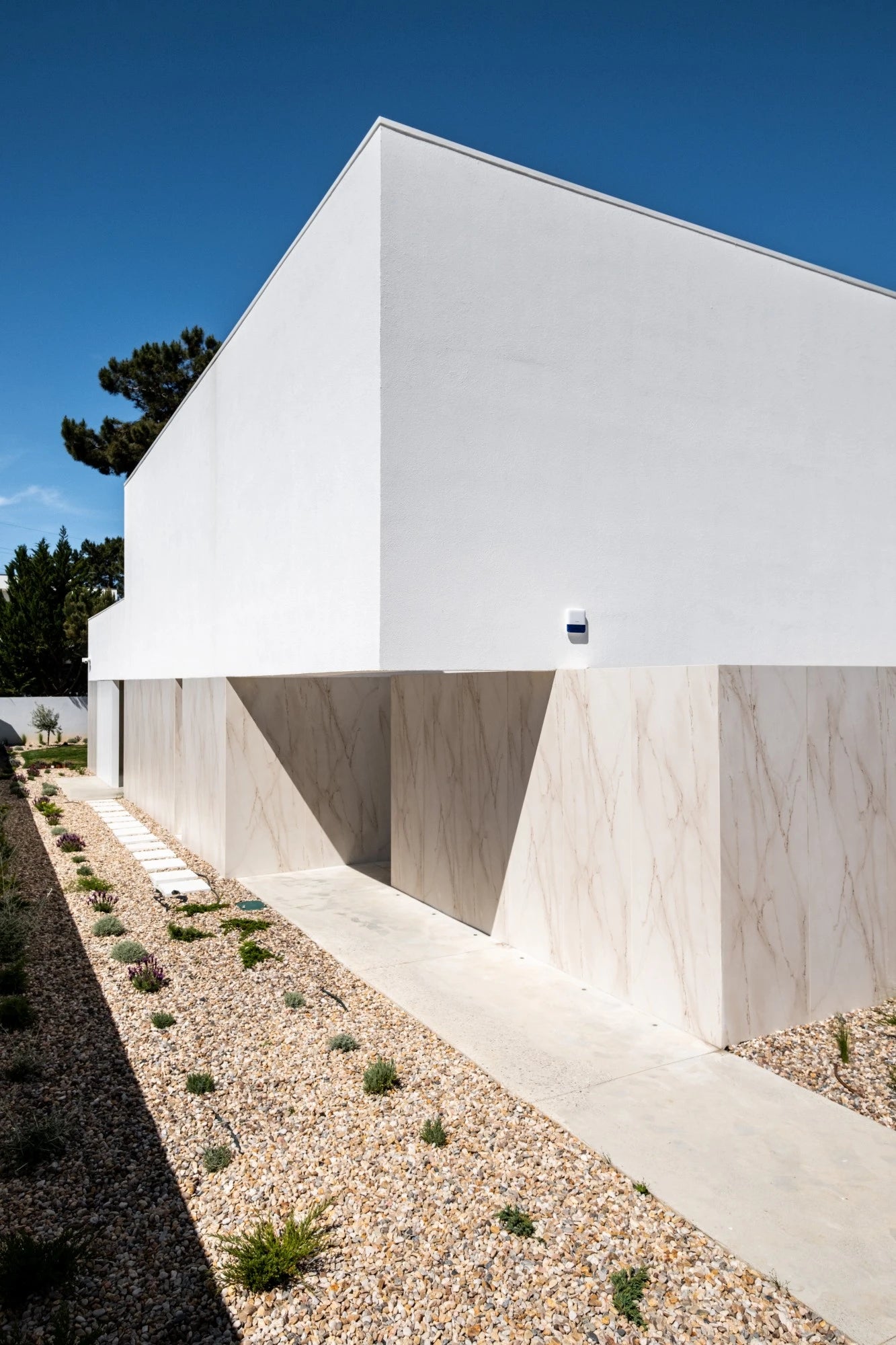 Dekton Rem exterior cladding with light beige veined finish on modern home facade — dekton kitchen countertops by Signature Stone Las Vegas