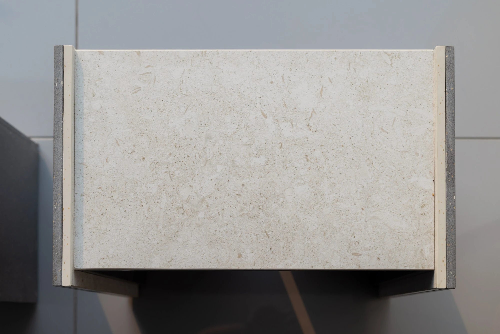 Dekton Sabbia countertop sample with light beige speckled surface and straight edges — premium dekton kitchen countertops by Signature Stone Las Vegas