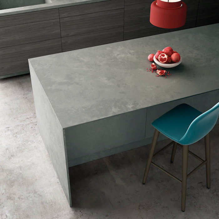Silestone Seaport kitchen island with concrete-look gray finish and waterfall edge — engineered quartz countertops fabricated and installed by Signature Ston...