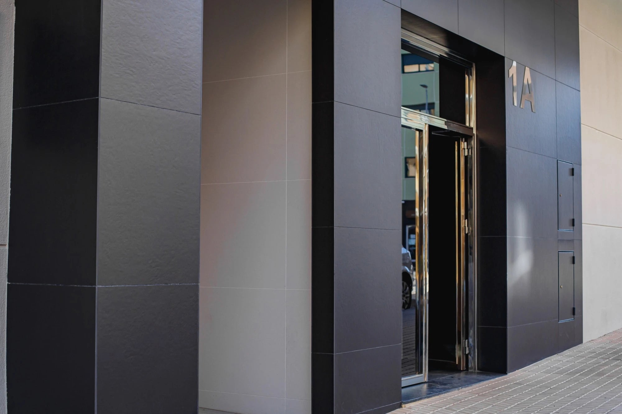 Dekton Sirius exterior cladding with sleek gray panels and modern architectural design — premium dekton countertops installed by Signature Stone Las Vegas