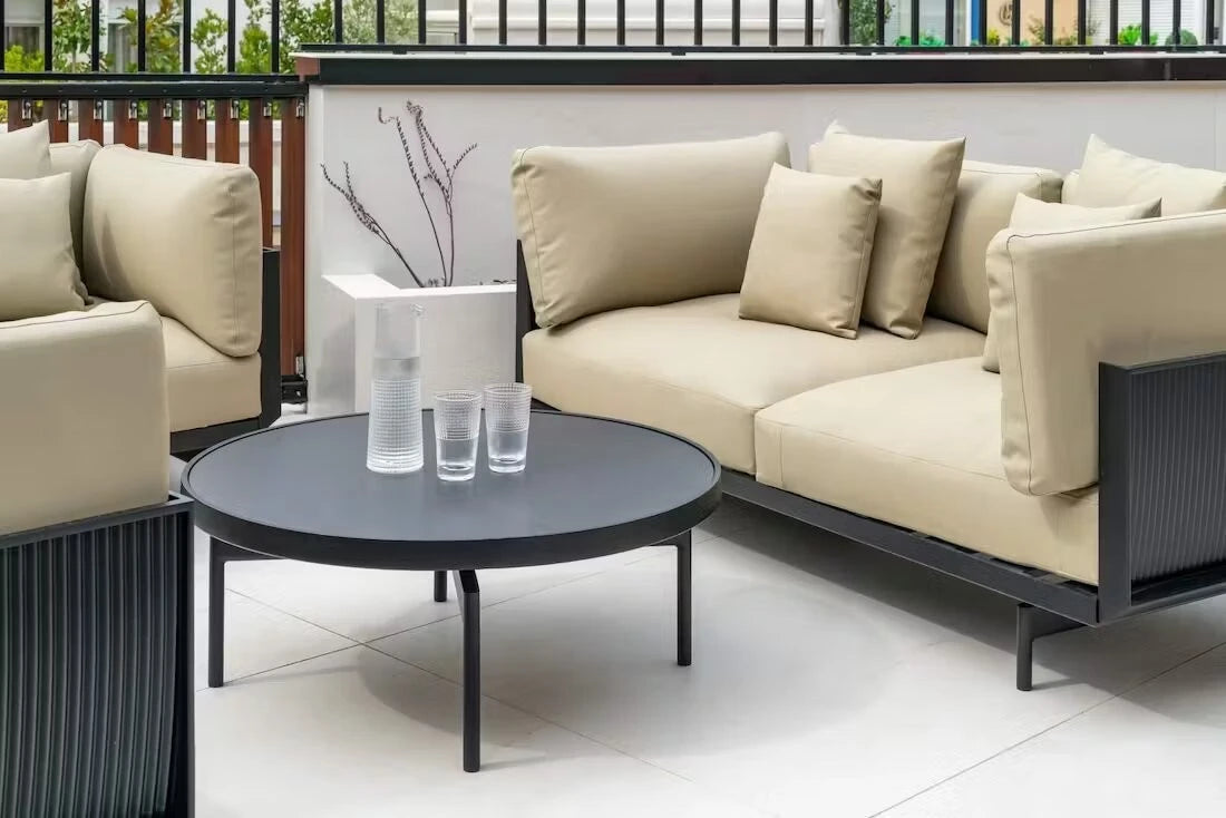 Dekton Sirius outdoor coffee table with matte gray finish and black metal legs — premium dekton surfaces fabricated and installed by Signature Stone LV
