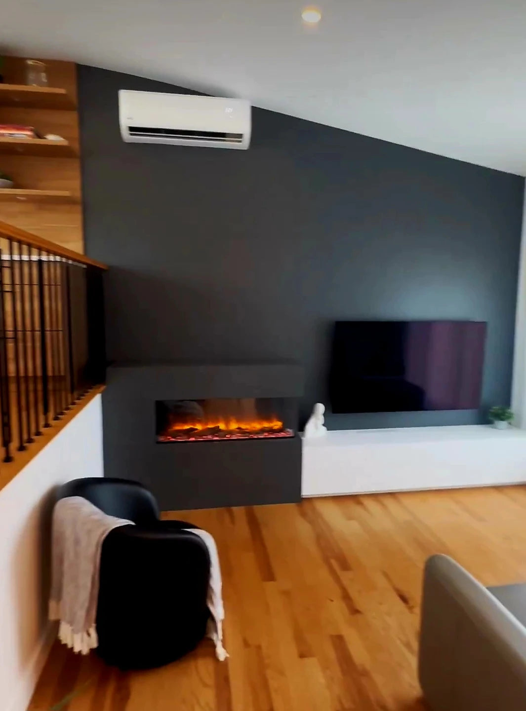 Dekton Sirius TV console with sleek gray finish and integrated fireplace — premium dekton surfaces fabricated and installed by Signature Stone LV