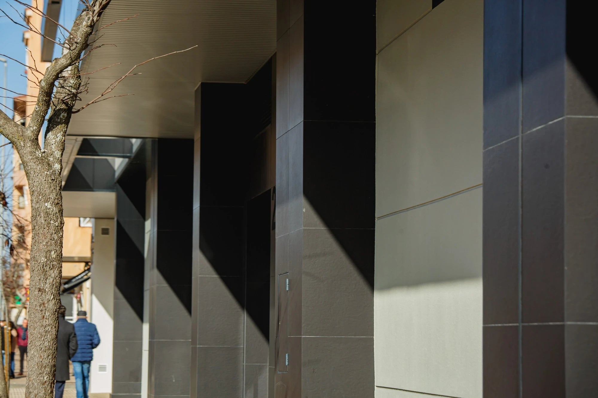 Dekton Sirius exterior cladding with smooth matte finish and clean geometric lines — premium dekton surfaces fabricated and installed by Signature Stone LV
