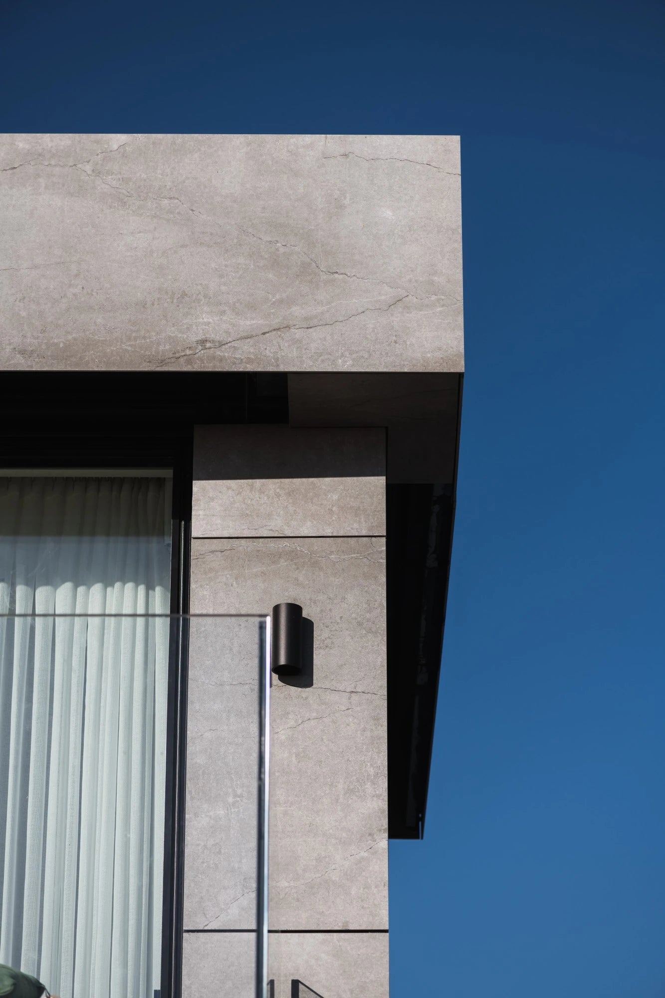 Dekton Soke exterior cladding with light gray marble-look finish and natural veining — dekton countertops installed by Signature Stone Las Vegas
