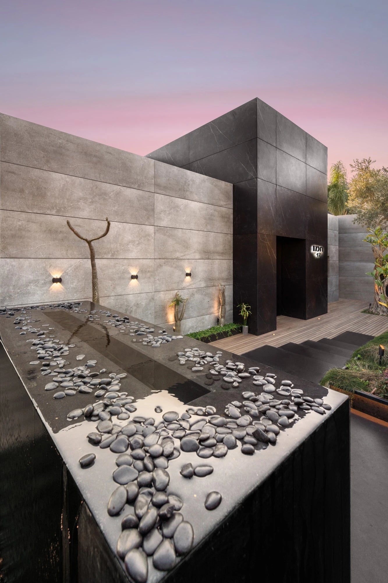 Dekton Soke exterior cladding with modern concrete gray finish and geometric panels — premium dekton surfaces fabricated and installed by Signature Stone LV