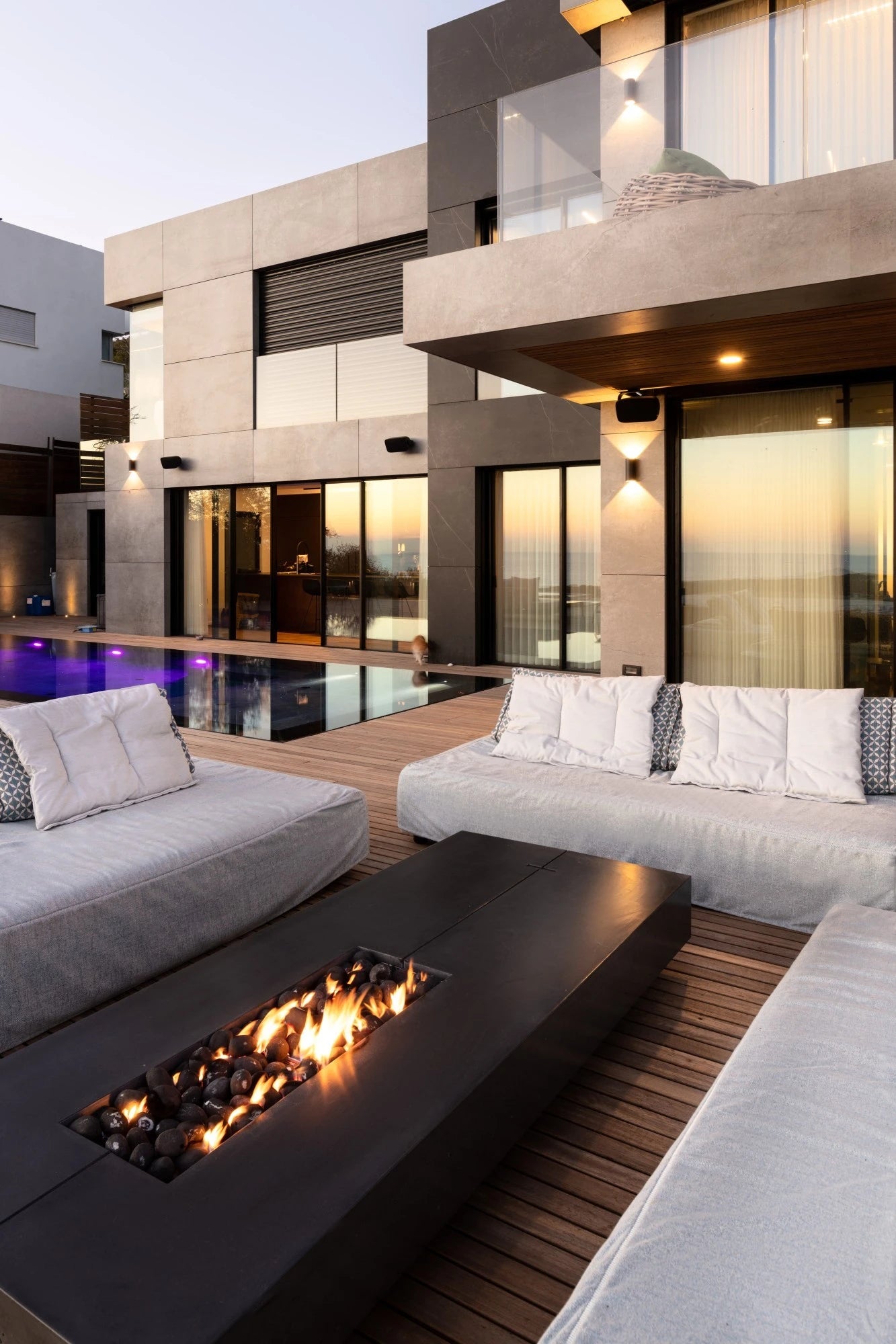 Dekton outdoor fire table with dark matte finish in modern patio setting — premium dekton countertops installed by Signature Stone Las Vegas