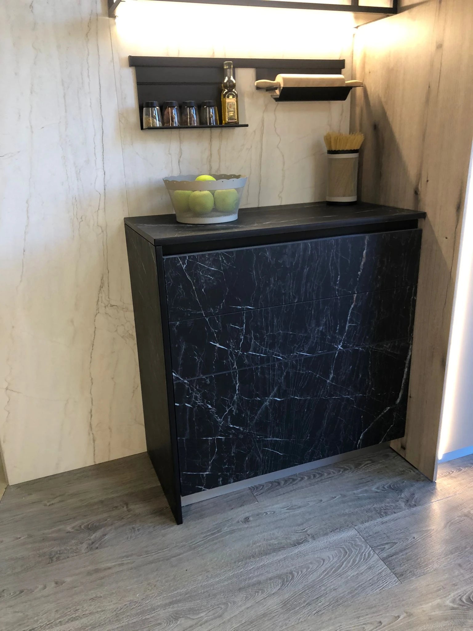 Dekton Somnia kitchen island with dark marble-look finish and black frame — premium dekton surfaces fabricated and installed by Signature Stone LV