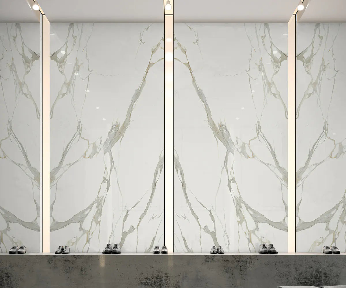 Statuario Michelangelo marble wall panels with dramatic white and gray veining — premium stone countertops installed by Signature Stone Las Vegas
