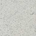 Silestone Stellar Snow surface with light gray background and scattered dark speckles in polished finish — quartz countertops installed by Signature Stone La...