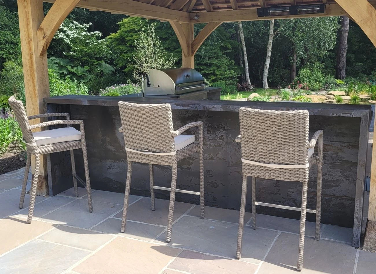 Dekton Trilium outdoor kitchen island with dark charcoal finish and clean edges — premium dekton surfaces fabricated and installed by Signature Stone LV