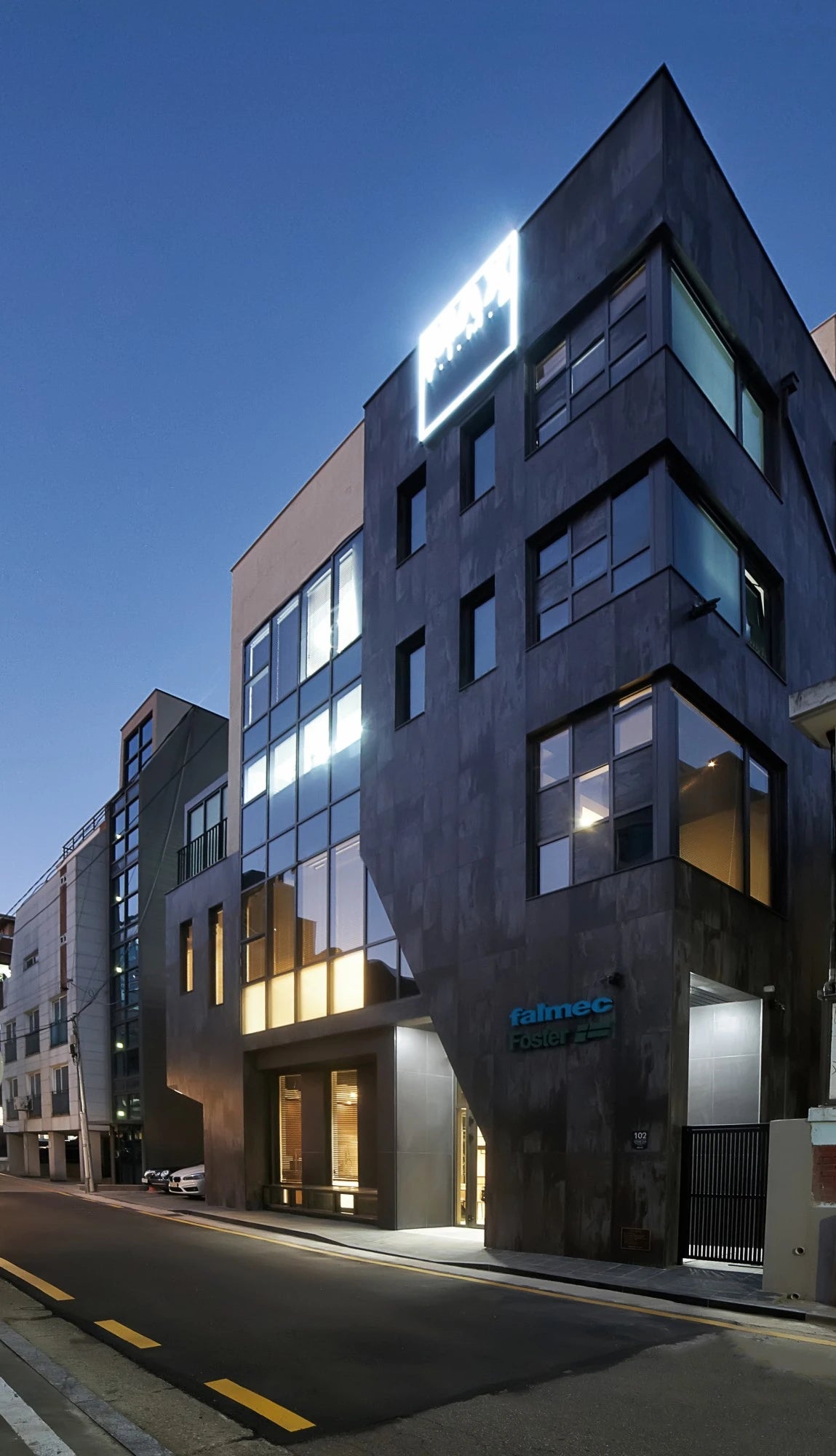 Dekton Trilium exterior cladding with dark charcoal finish and angular geometric design — premium dekton surfaces fabricated and installed by Signature Stone LV