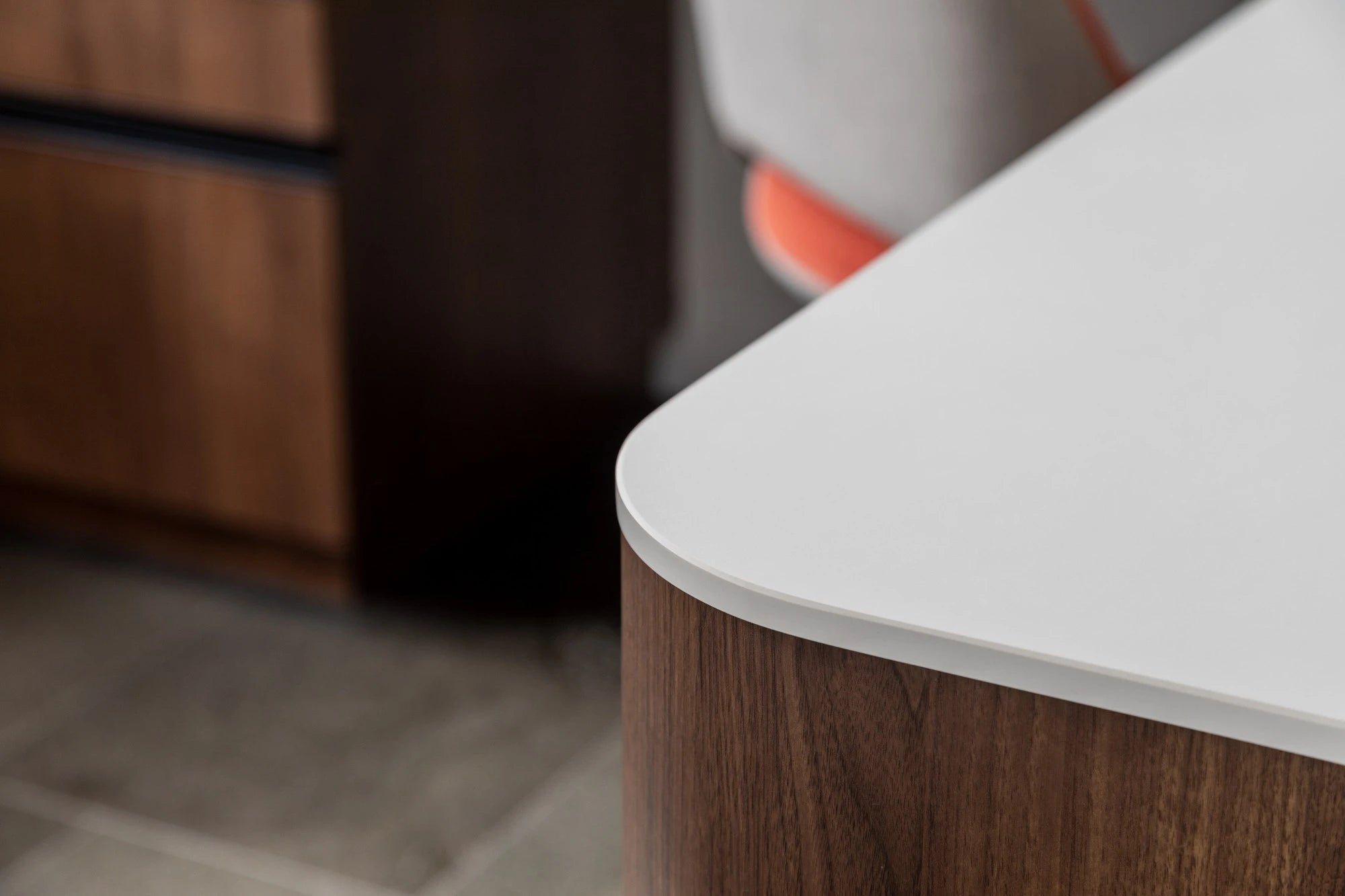 Dekton Uyuni surface with white top and wood grain base showing curved edge detail — premium dekton kitchen countertops by Signature Stone Las Vegas