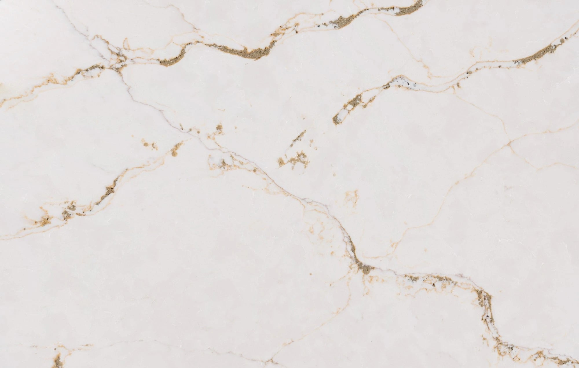 Silestone Versailles Ivory surface with soft white base and delicate golden veining — premium quartz countertops installed by Signature Stone Las Vegas
