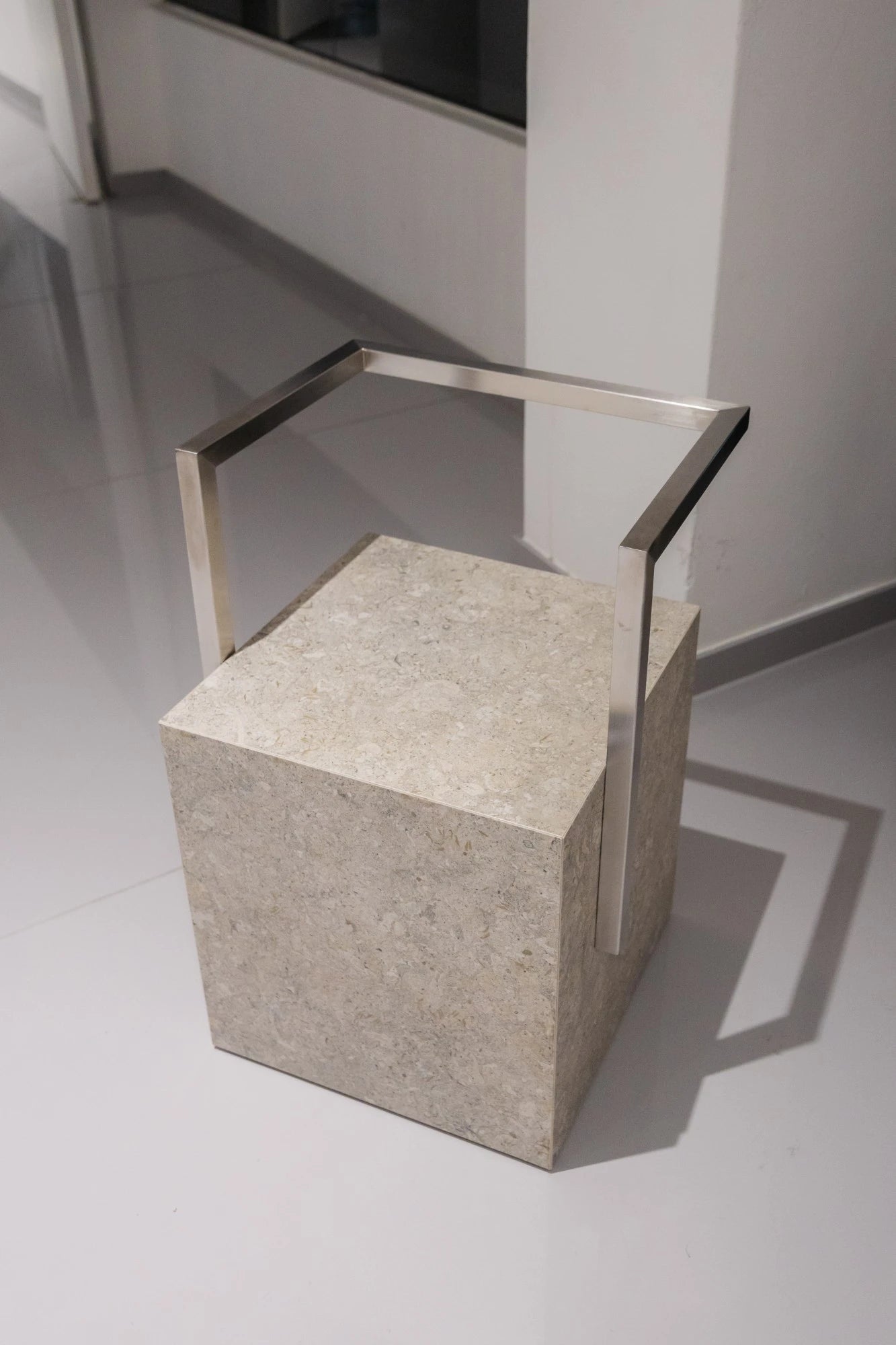 Dekton Grigio concrete-textured cube sample with metal frame — showcasing dekton kitchen countertops by Signature Stone Las Vegas