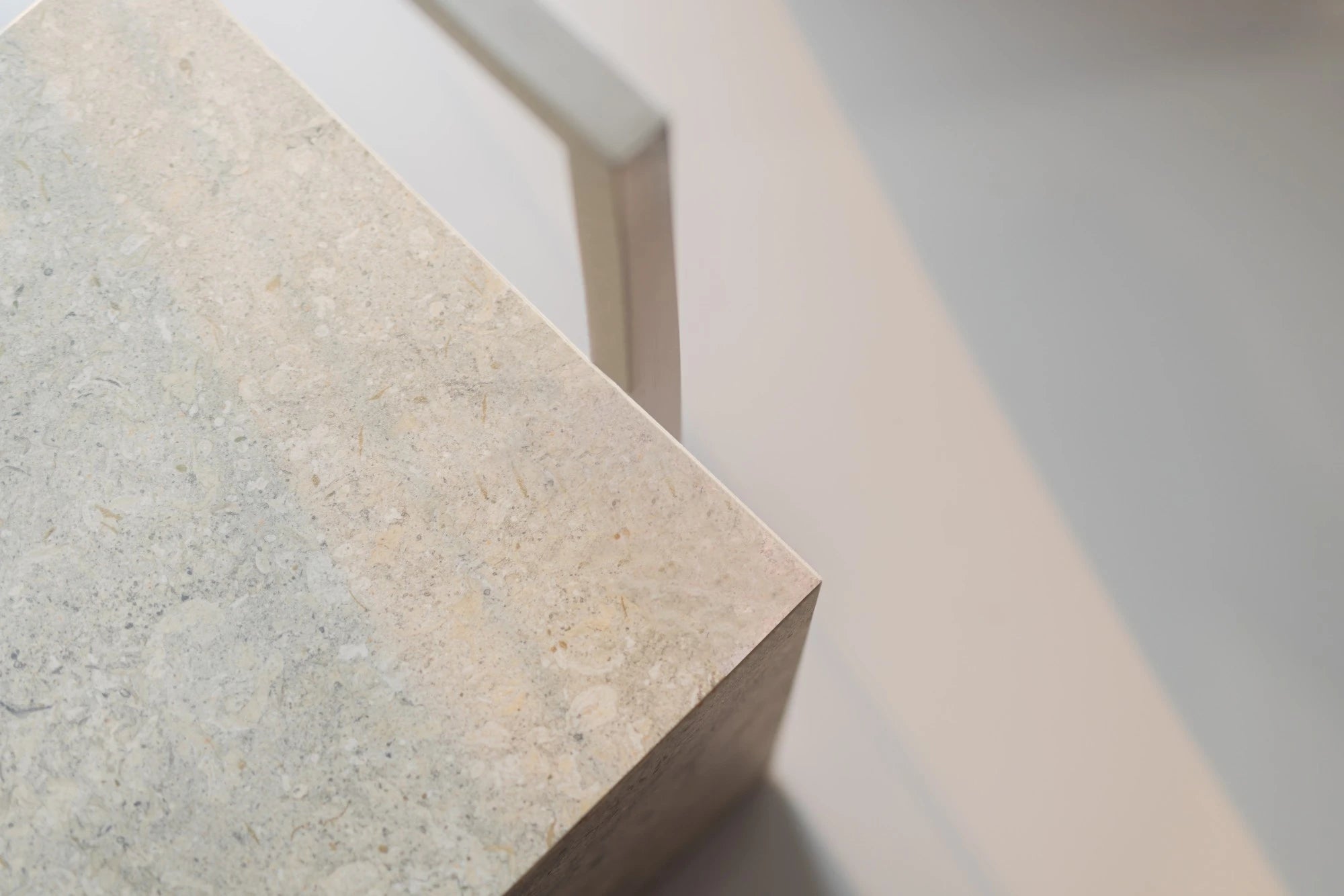 Dekton Grigio countertop edge detail showing light gray speckled finish — premium dekton surfaces fabricated and installed by Signature Stone LV