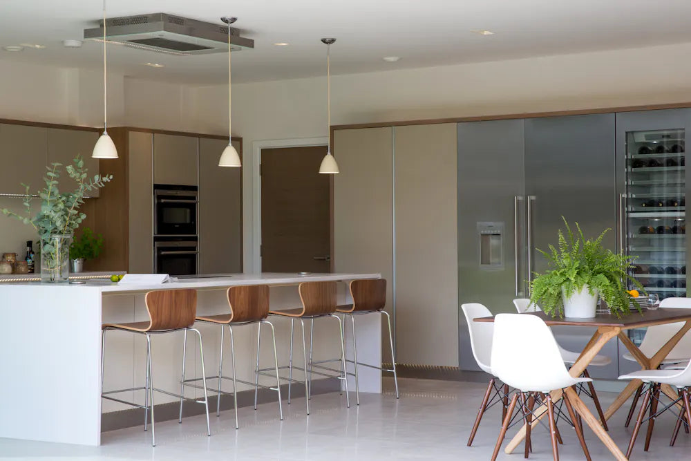 Silestone White North quartz kitchen island with clean white finish and waterfall edge — premium quartz countertops near me by Signature Stone Las Vegas