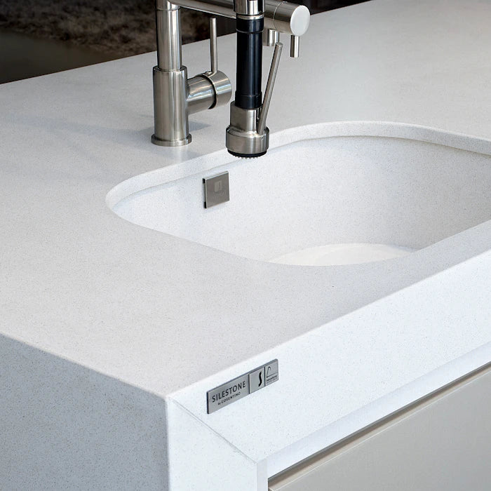 Silestone White Storm bathroom vanity with clean white finish and undermount sink — engineered quartz countertops fabricated and installed by Signature Stone LV