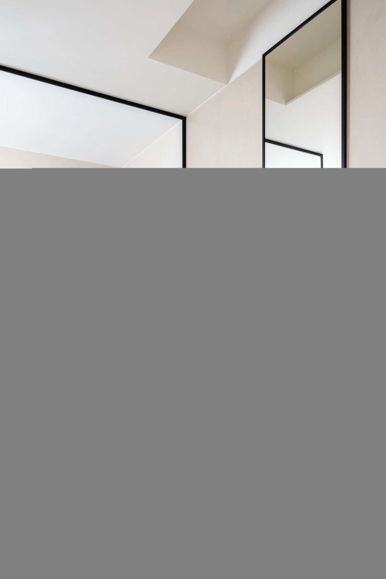 Dekton Zenith kitchen countertop featuring clean white surface with black metal cabinet frames — premium dekton countertops installed by Signature Stone Las ...