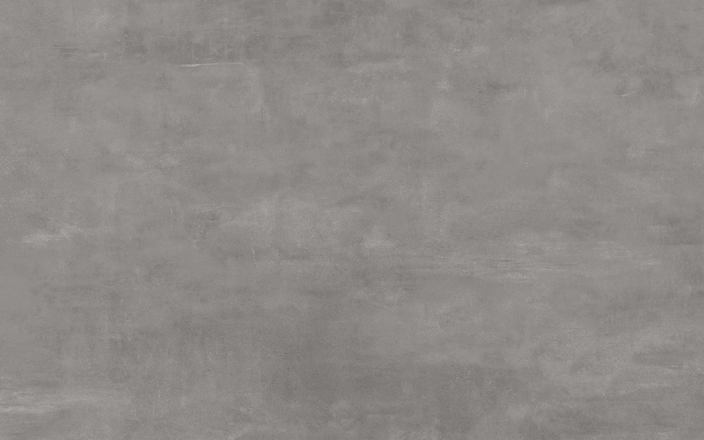 Boost Smoke quartz surface with smooth gray finish and subtle veining — custom countertops fabricated and installed by Signature Stone LV