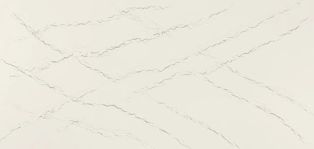 Quartz slab surface with cream background and subtle gray veining throughout — custom countertops fabricated and installed by Signature Stone LV