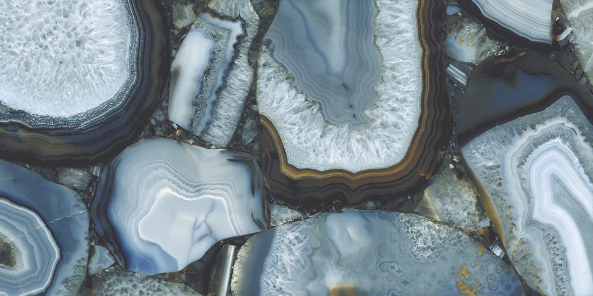 Agata Acqua natural stone slabs with blue and white banded patterns and polished finish — premium stone countertops installed by Signature Stone Las Vegas