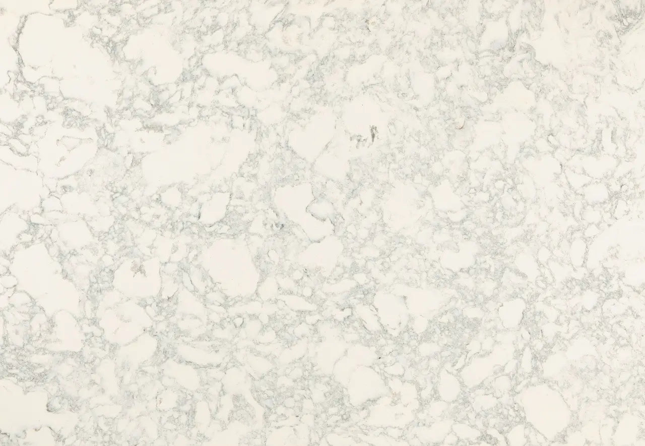 Quartz slab surface with soft white base and delicate gray veining throughout — elegant stone countertops installed by Signature Stone Las Vegas