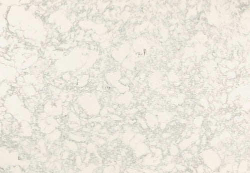 Quartz slab surface with soft white base and delicate gray veining throughout — elegant stone countertops installed by Signature Stone Las Vegas