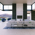 Modern living room with polished white stone surfaces and dark accent walls — premium stone countertops installed by Signature Stone Las Vegas