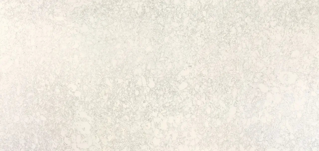 Ainsley quartz surface with subtle beige and cream veining in polished finish — custom countertops fabricated and installed by Signature Stone LV